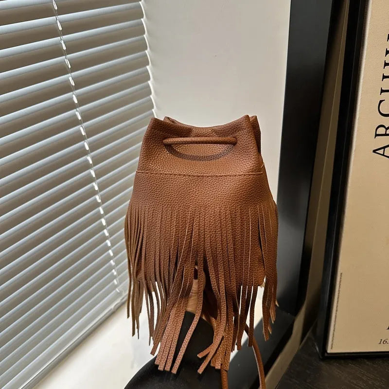 Women's soft leather tassel small satchel in bucket shape with open pocket, five colour options
