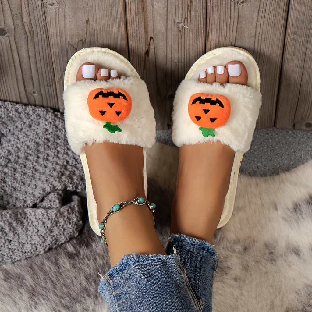 White and yellow Halloween pumpkin plush open toe slippers on anti-slip PVC sole.