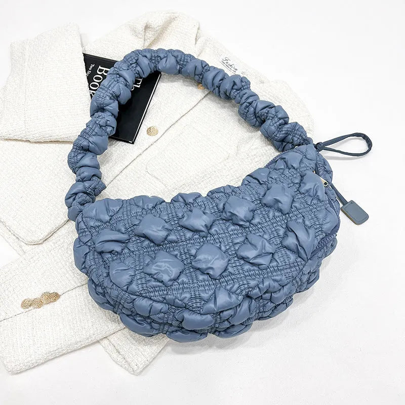 Women's nylon shoulder messenger bag in a solid colour with a long strap, showing front view.