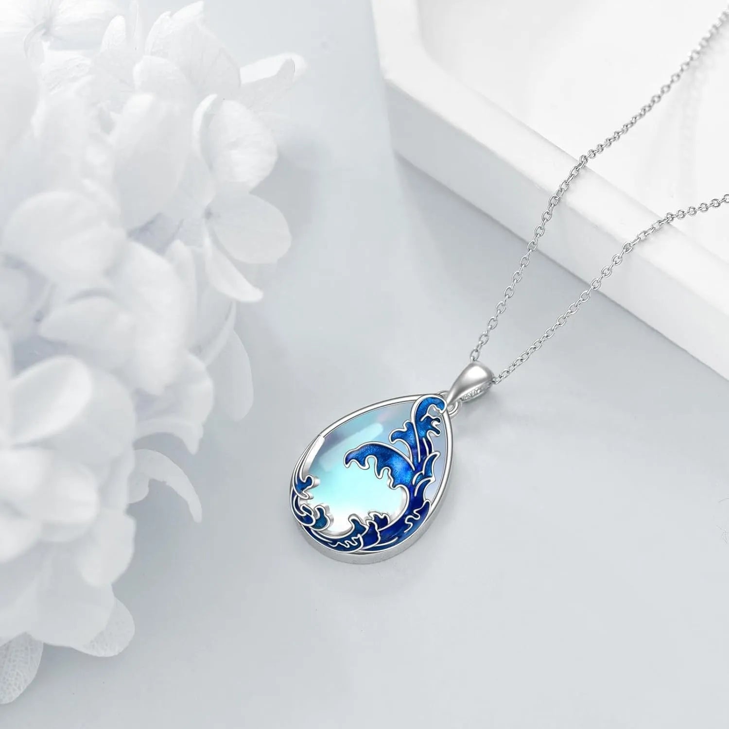 Moonstone blue alloy heart pendant necklace for women on a silver-toned chain.