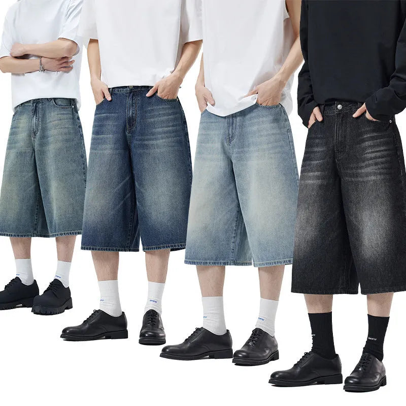 Man wearing straight-leg light blue denim shorts, showcasing the cropped length and loose casual fit.