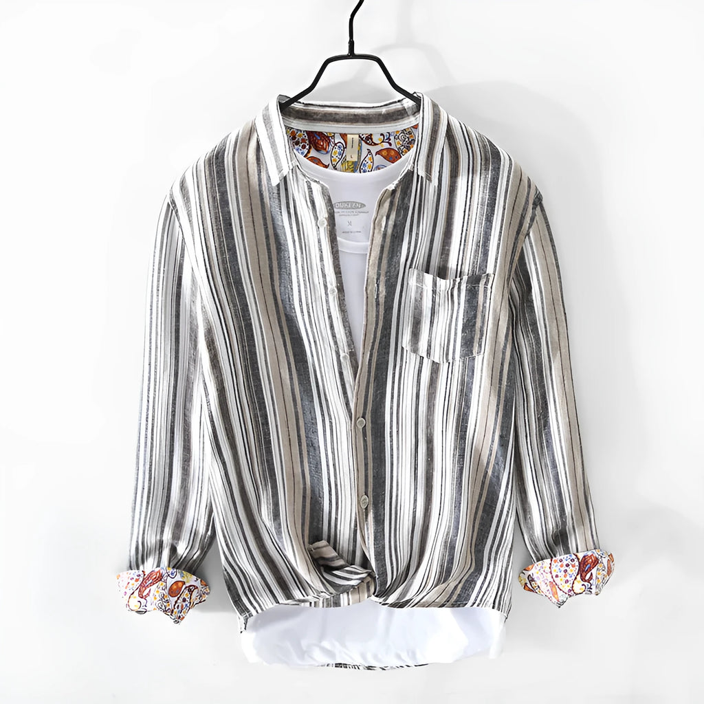 A man's casual red and grey striped linen shirt with long sleeves, laid flat to show its loose fit.