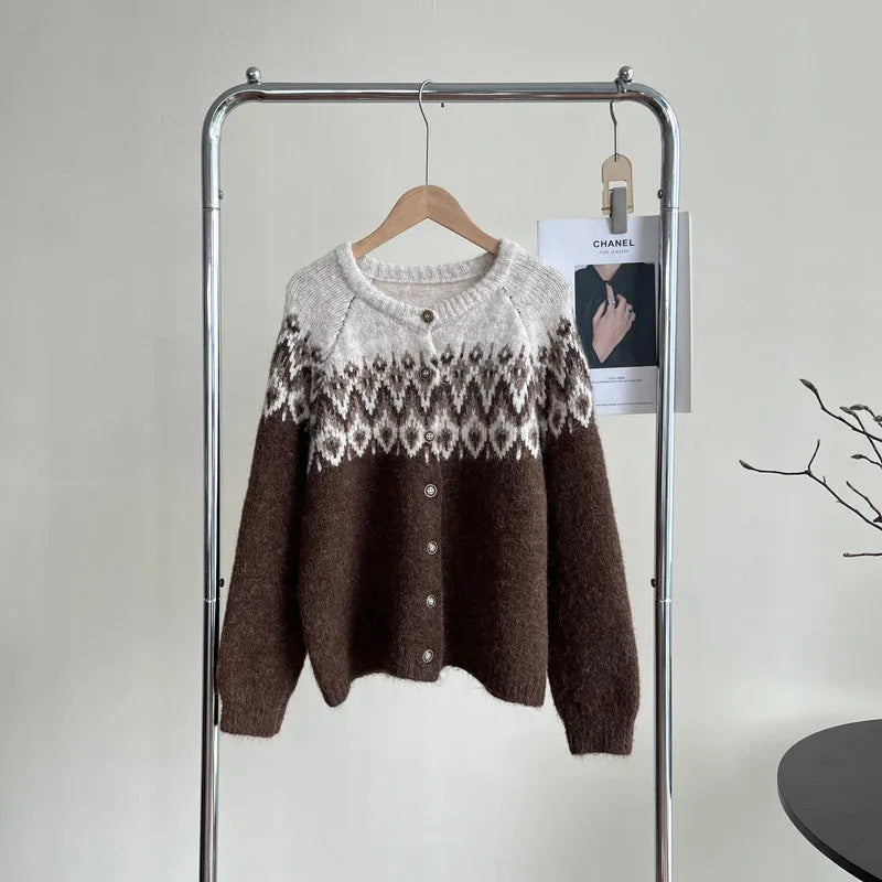 Women's thick jacquard knit sweater coat in a loose fit, shown in milky white colour with long sleeves.