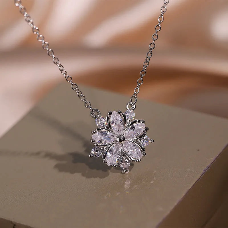 Double layer flower cubic zirconia ring necklace and stud earrings set in white copper on display