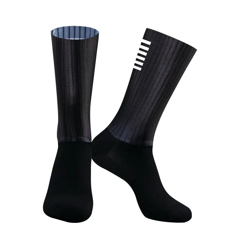 Pair of breathable chemical fibre blend athletic socks for cycling and running, shown in orange colour.