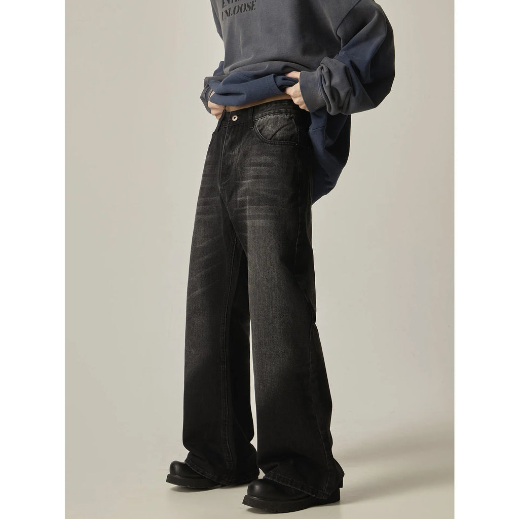 Black loose straight jeans with retro styling and zipper fly in polyester denim fabric