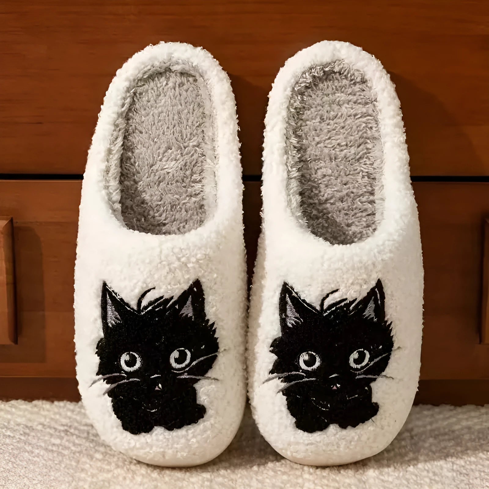White plush cotton couple slippers with black cat cartoon design and non-slip TPR soles