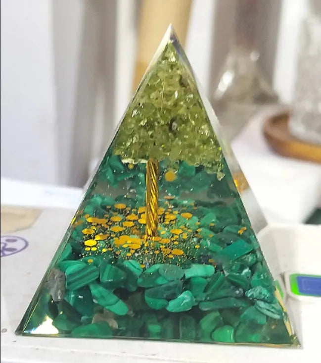 Clear epoxy resin pyramid ornament with embedded coloured crystal gravel inside, measuring 6cm.