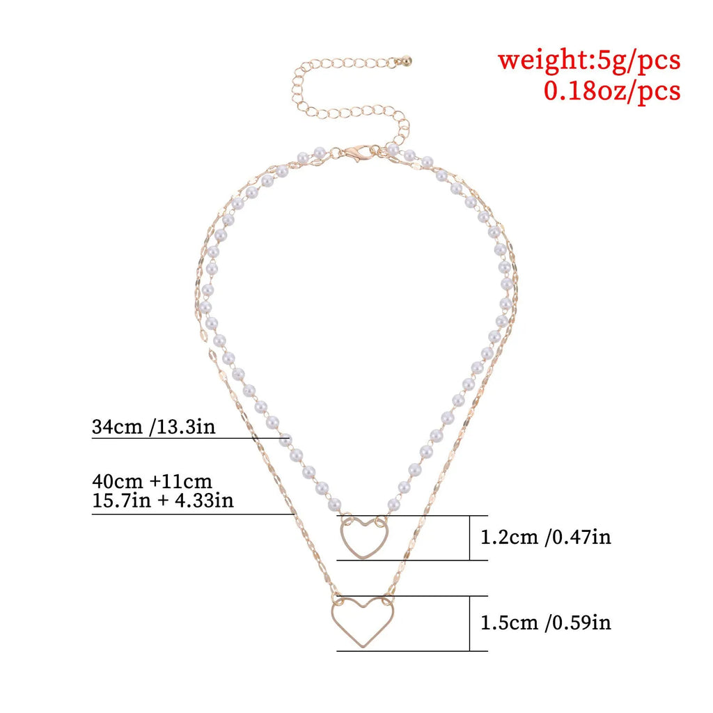 Gold heart-shaped zinc alloy pendant necklace on adjustable chain