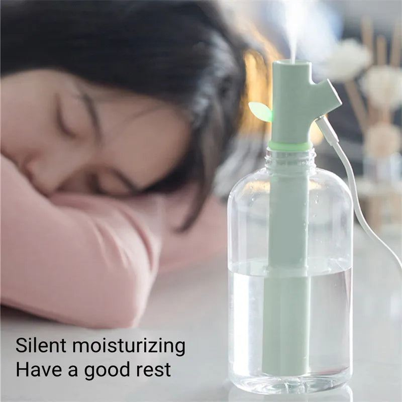 Transparent portable USB humidifier with round design and water bottle attachment