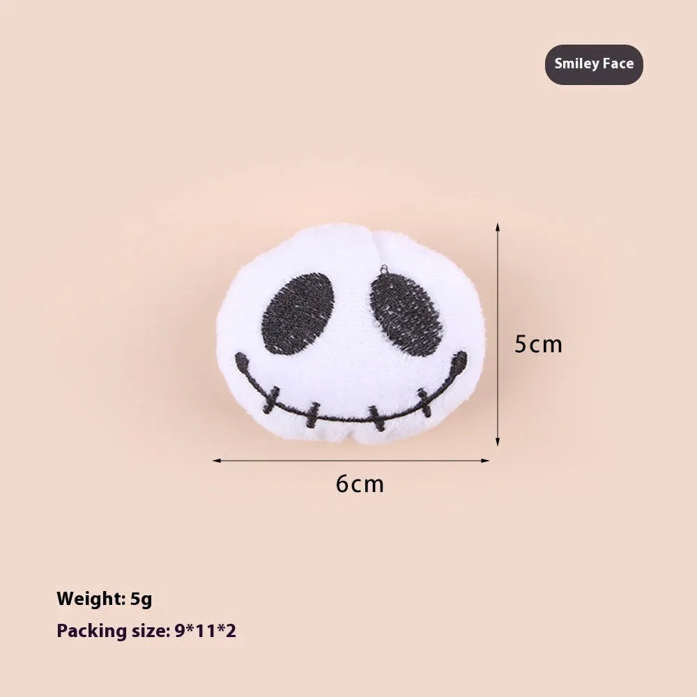 Small cat teaser wand with a soft plush head in eyes, candy, or skull design