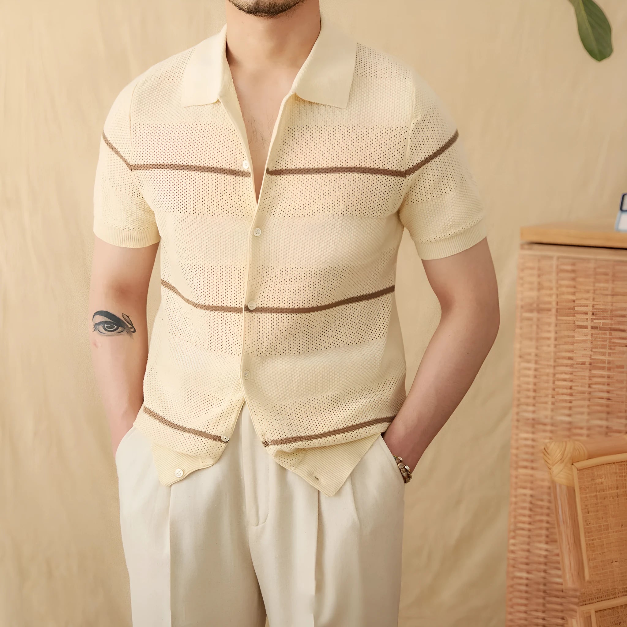Camel coloured linen cotton short sleeve cardigan with a lapel collar laid flat.
