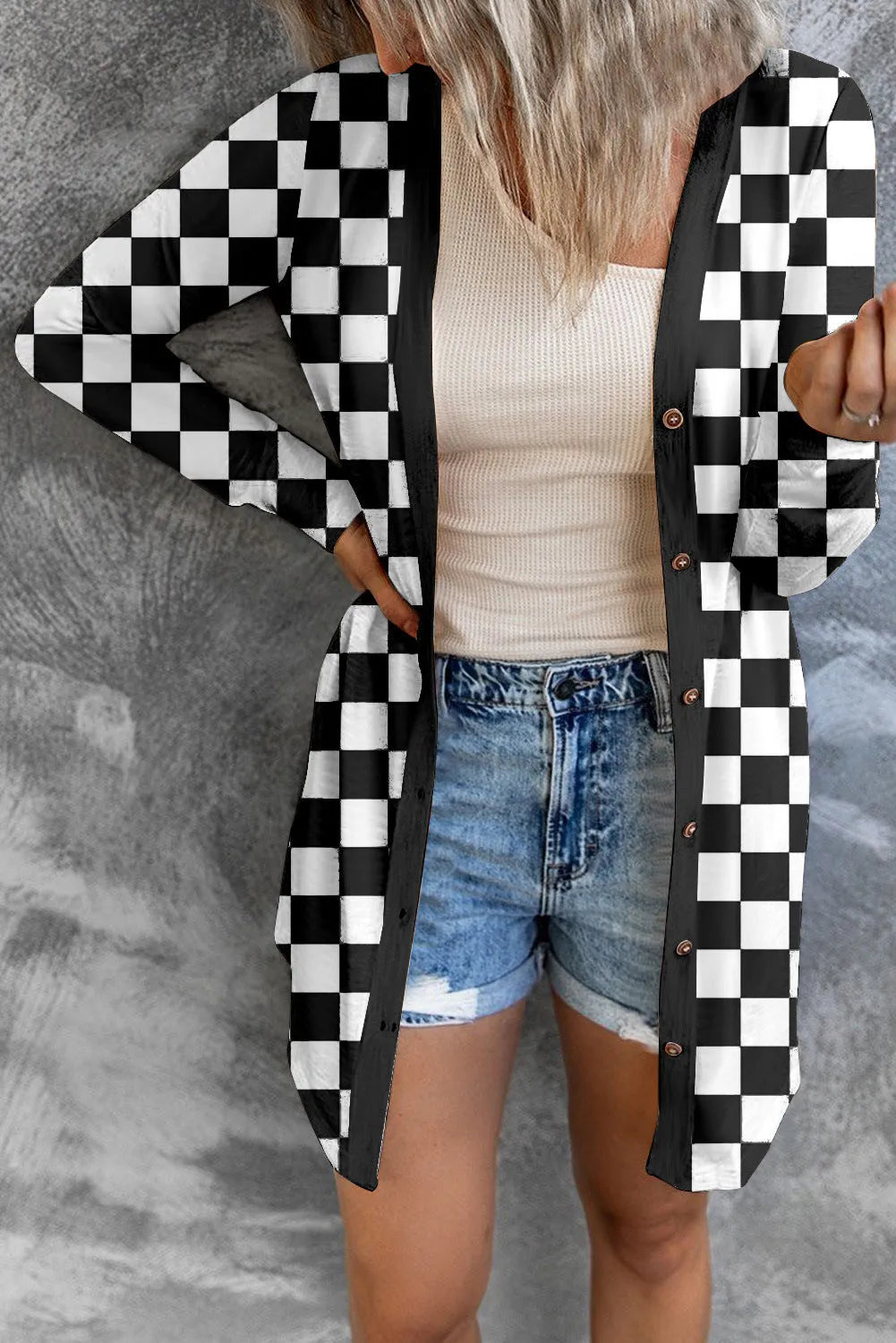 Women's long grey plaid knitted coat cardigan with contrasting colour blocks, loose fit, and regular sleeves.