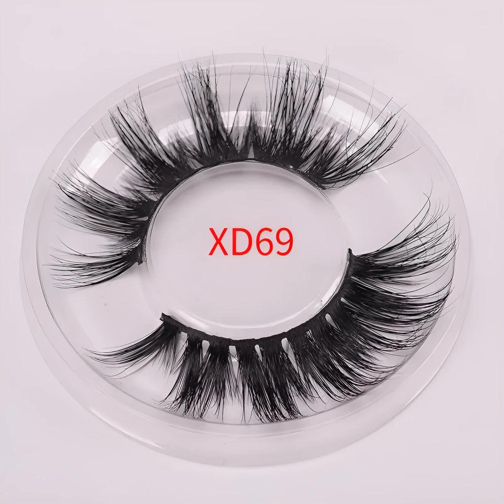 Handmade 5D volume false eyelashes made from mink hair with a storage case and application brush.