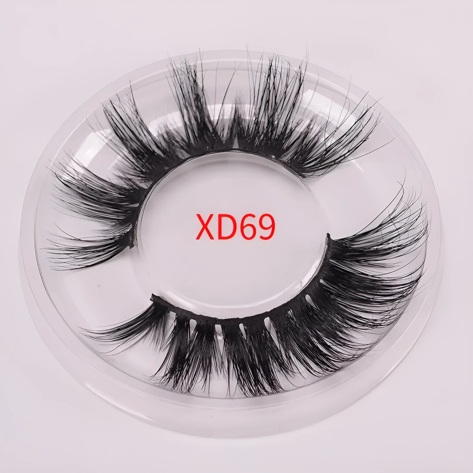 Handmade 5D volume false eyelashes made from mink hair with a storage case and application brush.