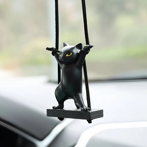 Resin cartoon cat pendant for car interior decoration on adjustable rope.