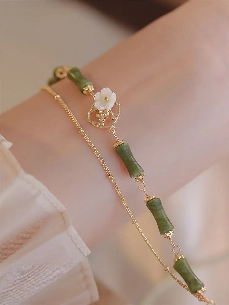 Natural olivine bracelet with double layer twin bells of Ireland design and olive branch elements