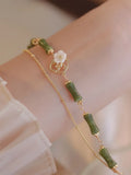 Natural olivine bracelet with double layer twin bells of Ireland design and olive branch elements