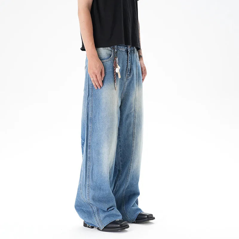 Light blue vintage wash wide leg denim jeans on a model, showing the relaxed fit and zip fly.
