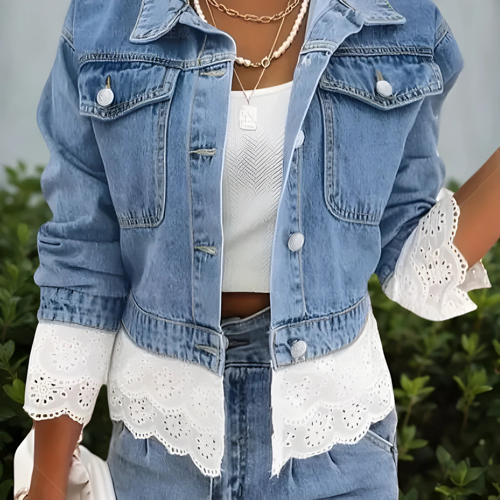 Blue women's denim jacket with lace stitching detail on the front, long sleeves.