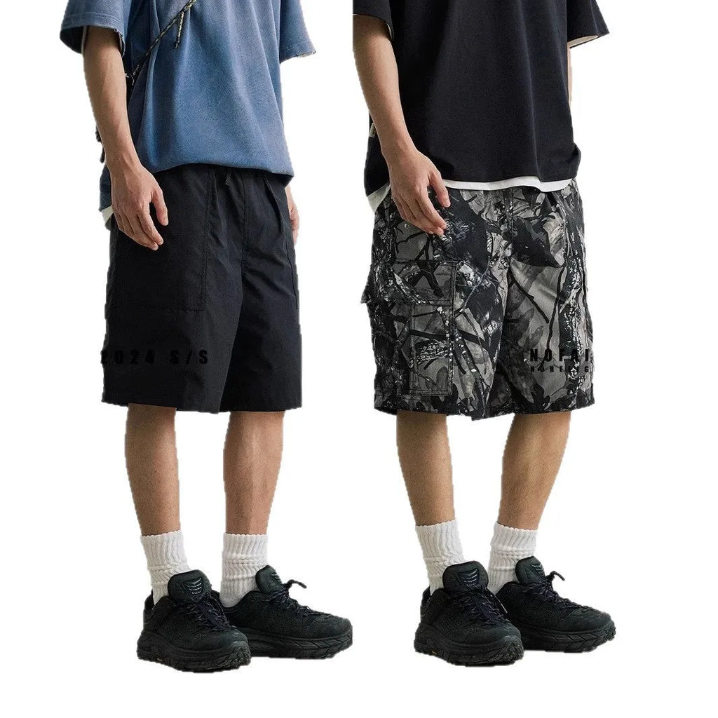 Loose straight-leg denim shorts in army green with a zip fly and elasticated mid-waist.