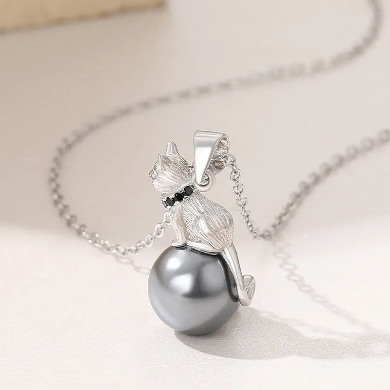 Sterling silver cat pendant necklace on a chain, showing elegant clavicle-length design.