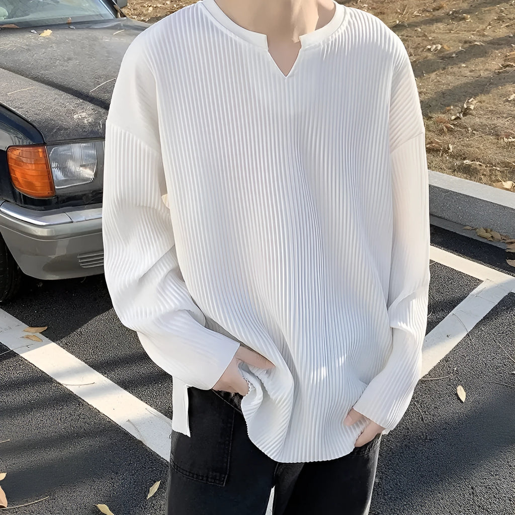 Women's plus size striped texture pullover top in grey, showing loose fit and long sleeves.
