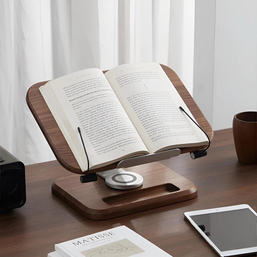 Walnut-coloured solid wood adjustable reading rack holding a book.