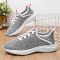 Women's low-top casual sneakers in black, grey, or pink with breathable mesh upper and lightweight EVA sole.