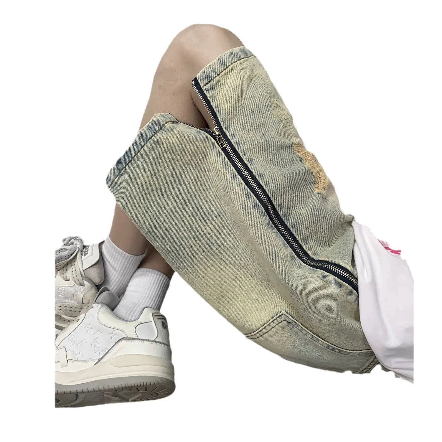 Men's blue retro denim shorts with yellow mud distressing, rips, button fly, and a loose fit.