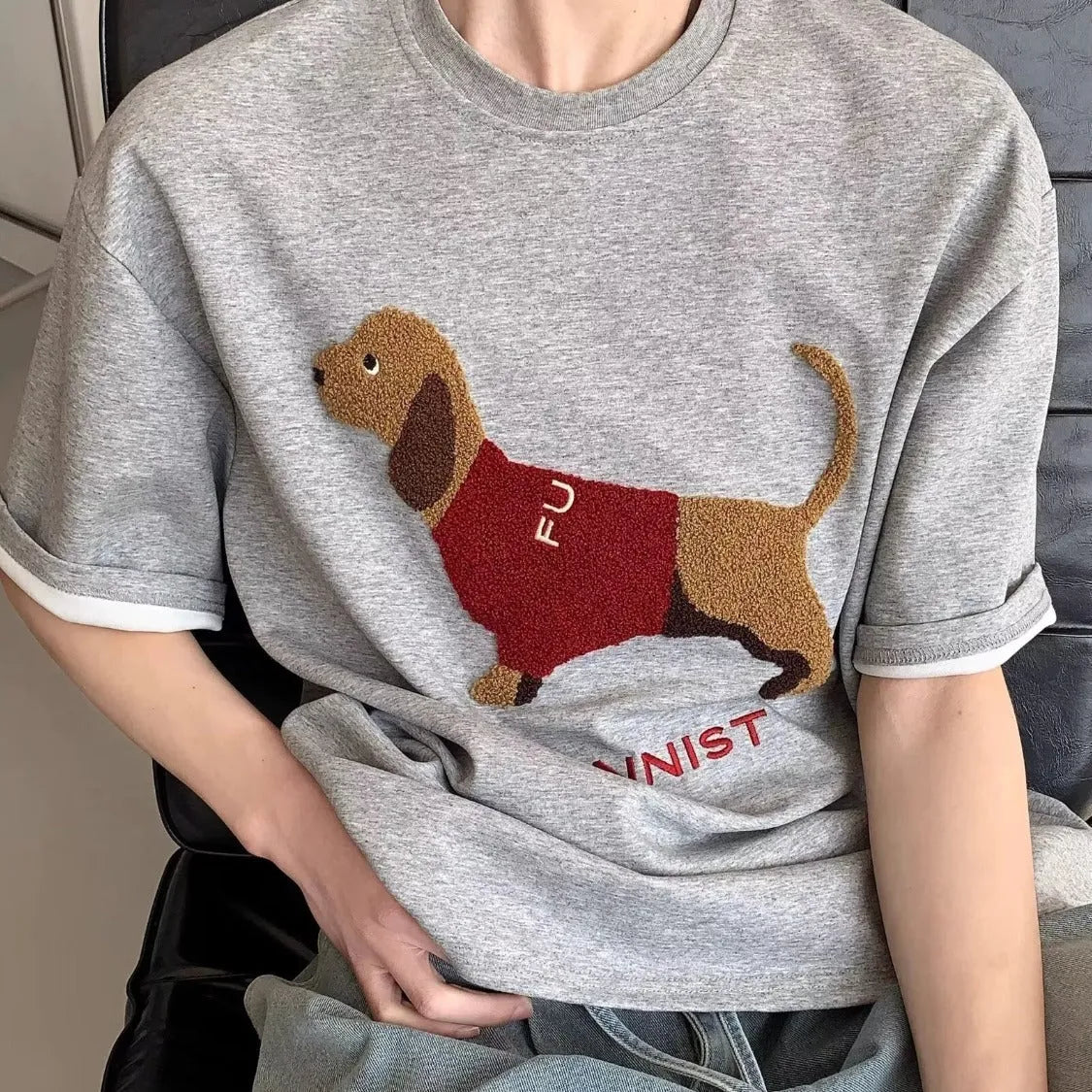 Men's grey cotton T-shirt with embroidered sausage dog design on front, round neck and short sleeves