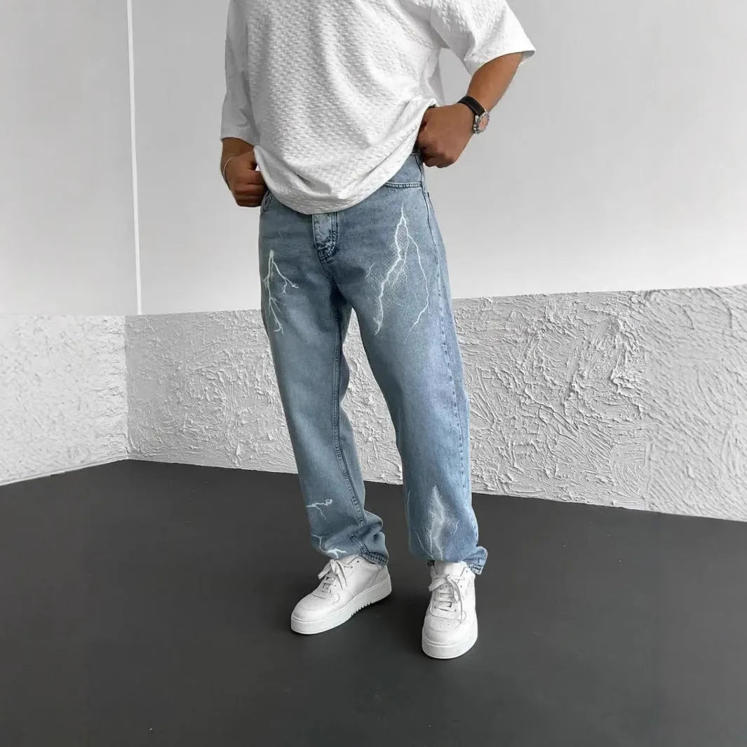 Men's blue straight-leg denim jeans with mid-waist design and loose wide-leg silhouette
