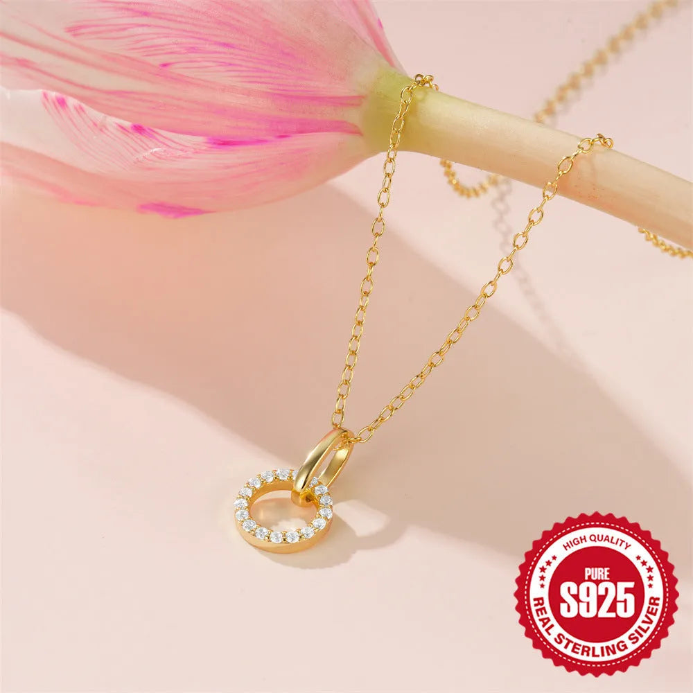 Gold colour geometric sterling silver necklace with interlocking design and zircon details on adjustable chain