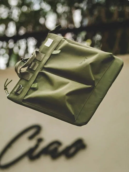 Retro style canvas crossbody messenger bag in military green with adjustable shoulder strap and zipper closure