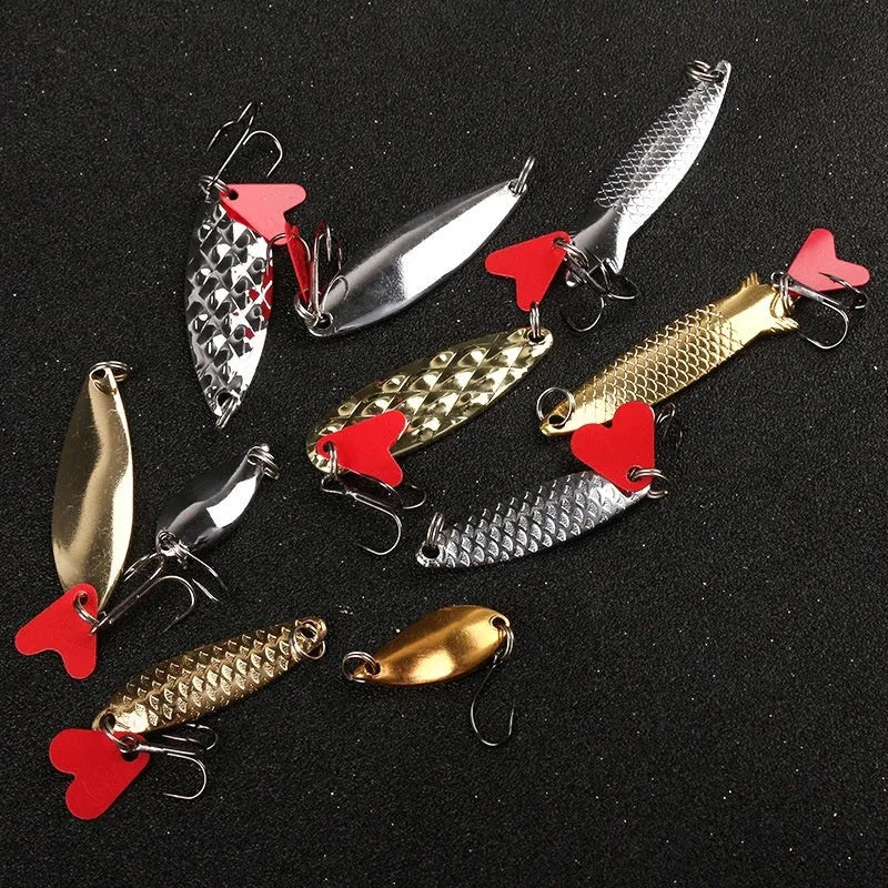 Pineapple-shaped metal fishing lures with metallic sequins in gold and silver colours