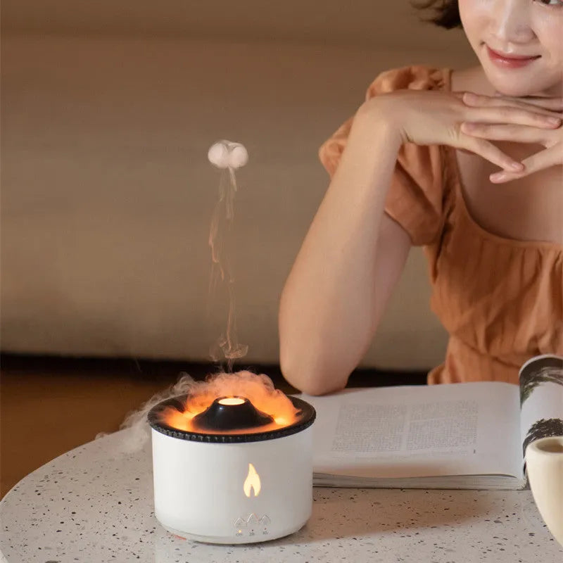 Round two-colour flame spray mist humidifier and aromatherapy diffuser on a table.