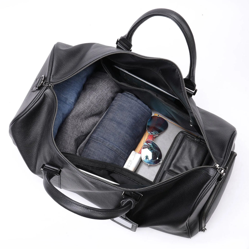 Men's black leather tote bag with a single shoulder strap, shown open to display large capacity.