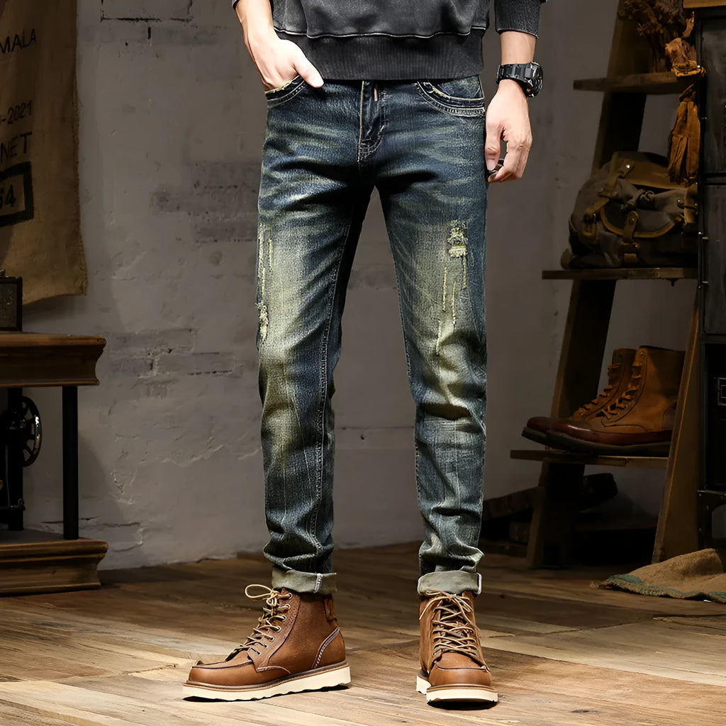 Men's skinny fit stretch jeans in a retro colour, showing zip fly and slim leg cut.