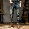Men's skinny fit stretch jeans in a retro colour, showing zip fly and slim leg cut.