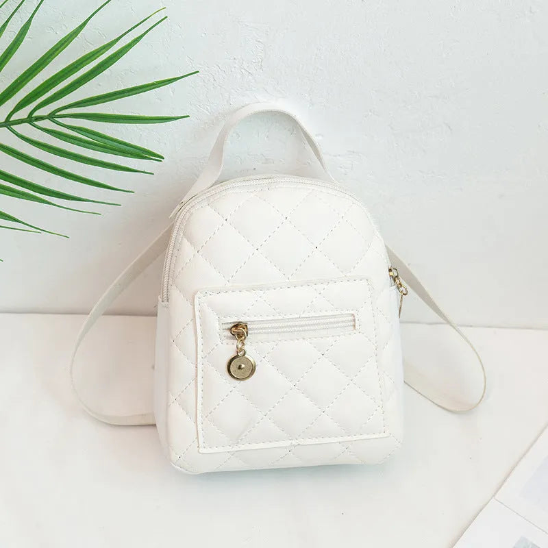 Girls' hard case Korean-style embroidered backpack in pink showing vertical square shape and soft carry handle.