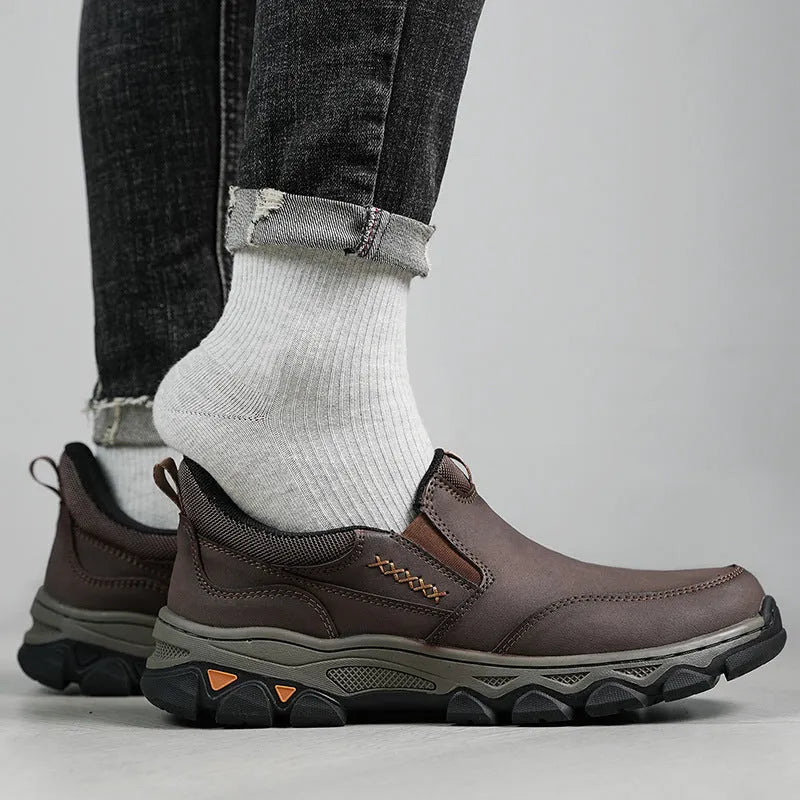 Men's dark brown casual leather-look shoes with round toe and flat rubber sole.