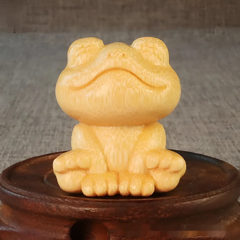 Solid bamboo carving ornament of smiling frog design measuring 5cm height and 4.5cm diameter