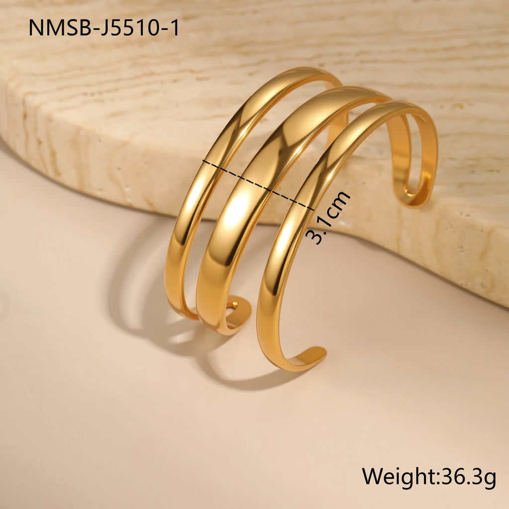 Women's stainless steel bracelet with 18K gold electroplating in geometric open design with line elements