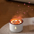 Round two-colour flame spray mist humidifier and aromatherapy diffuser on a table.