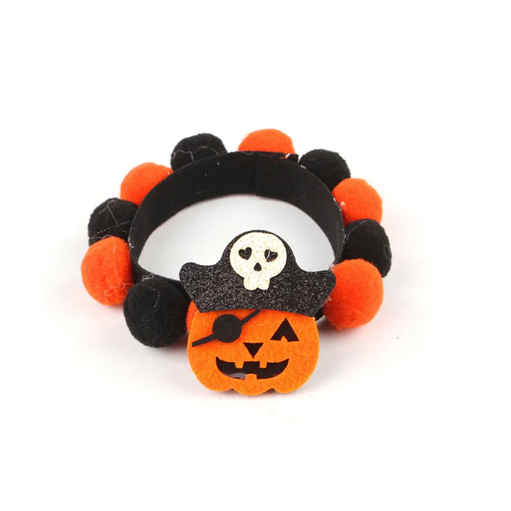 Halloween pet collar with soft fur ball pumpkin accessory in orange, sized on a dog's neck.