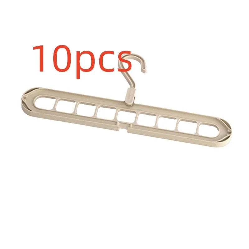 Green plastic nine-hole hanger folded flat showing multiple trouser hanging points