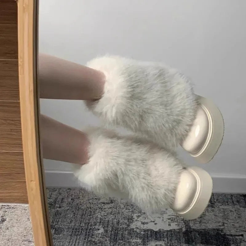 Women's low top snow boots with artificial plush construction and waterproof rubber sole