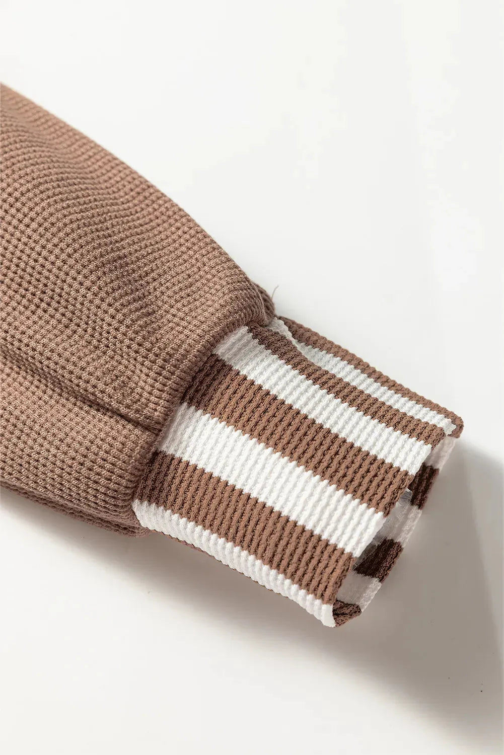 Straw yellow waffle texture striped patchwork hoodie with button neck and drawstring hood.