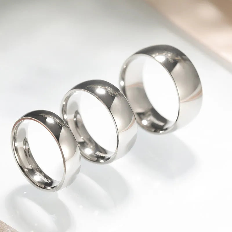 Silver titanium steel ring showing different width options on a hand