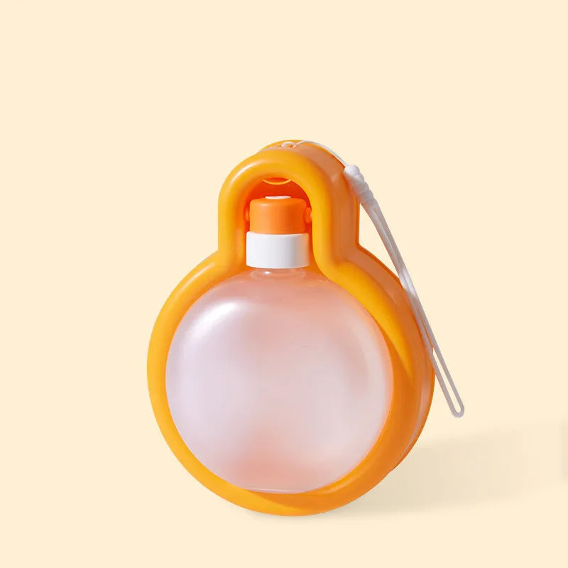 Green portable dog travel cup with integrated drinking bowl, showing 500ml capacity and pull-out bowl design.